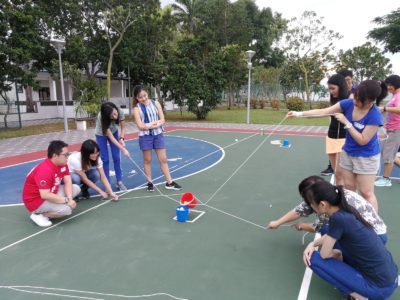 Group holding buckets with strings