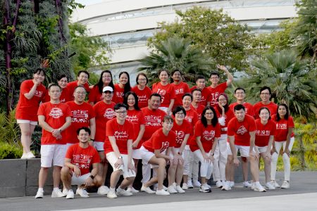 Beacon staff wearing red and white outfits for National Day Celebration